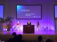 株式会社 廣建 創立35周年記念式典で祝辞を述べる衛藤議員（平成28年12月10日　都内）